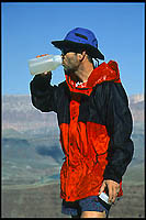 Enjoying a drink, along the Escalante Route, high above the Colorado River.  (c) Rob Kleine. GentlEye Imagery.