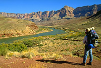 Backpacker pauses along the Escalante Route to admire the Colorado River.  Grand Canyon National Park. #10076. (c) Rob Kleine.  All Rights Reserved.